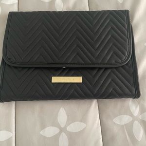 Jewelery Travel Case. 11” x 9” when folded Quilted design has hanger detail.